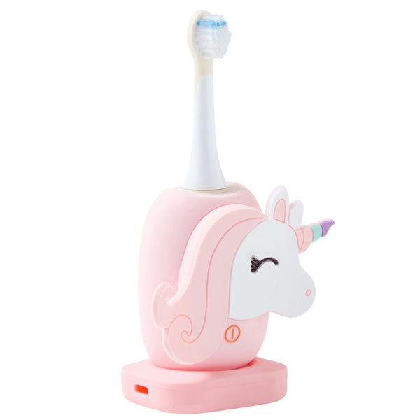 Kinder-Schallzahnbürste Einhorn von The Zoofamily auf der Ladestation, Schrägansicht mit Ladeanzeige