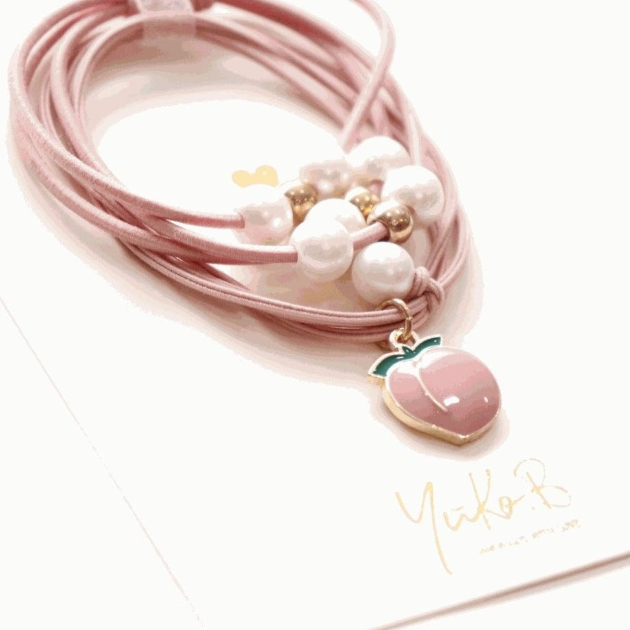 Yuko B. Haargummi-Armbänder Pfirsich - 2 Stück - Produktbild