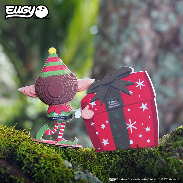 Eugy Weihnachtsmann-Puzzle mit einem Elfen und einem Geschenkpäckchen im festlichen Design