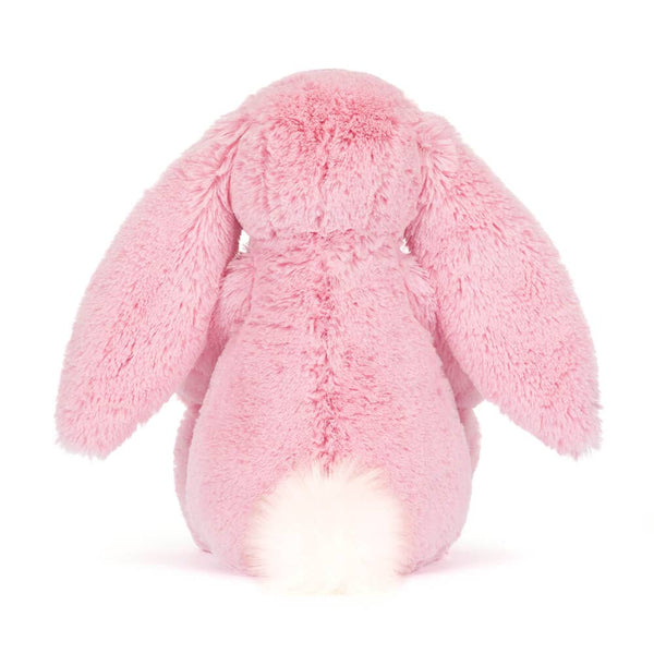 Rückansicht von einem Plüschkaninchen LUX mit Blumenöhrchen in Rosa, perfekt zum Kuscheln.