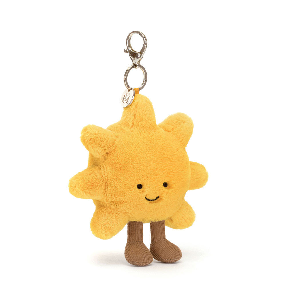 Schlüsselanhänger – Lächelnde Sonne 20 cm von Jellycat, weicher gelber Plüsch mit Füßen und lachendem Gesicht
